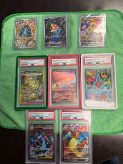 Pokemon PSA 10 slabs and RAW