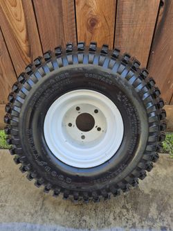 LIKE NEW 21X11X8 GOOD YEAR TIRE WITH RIM