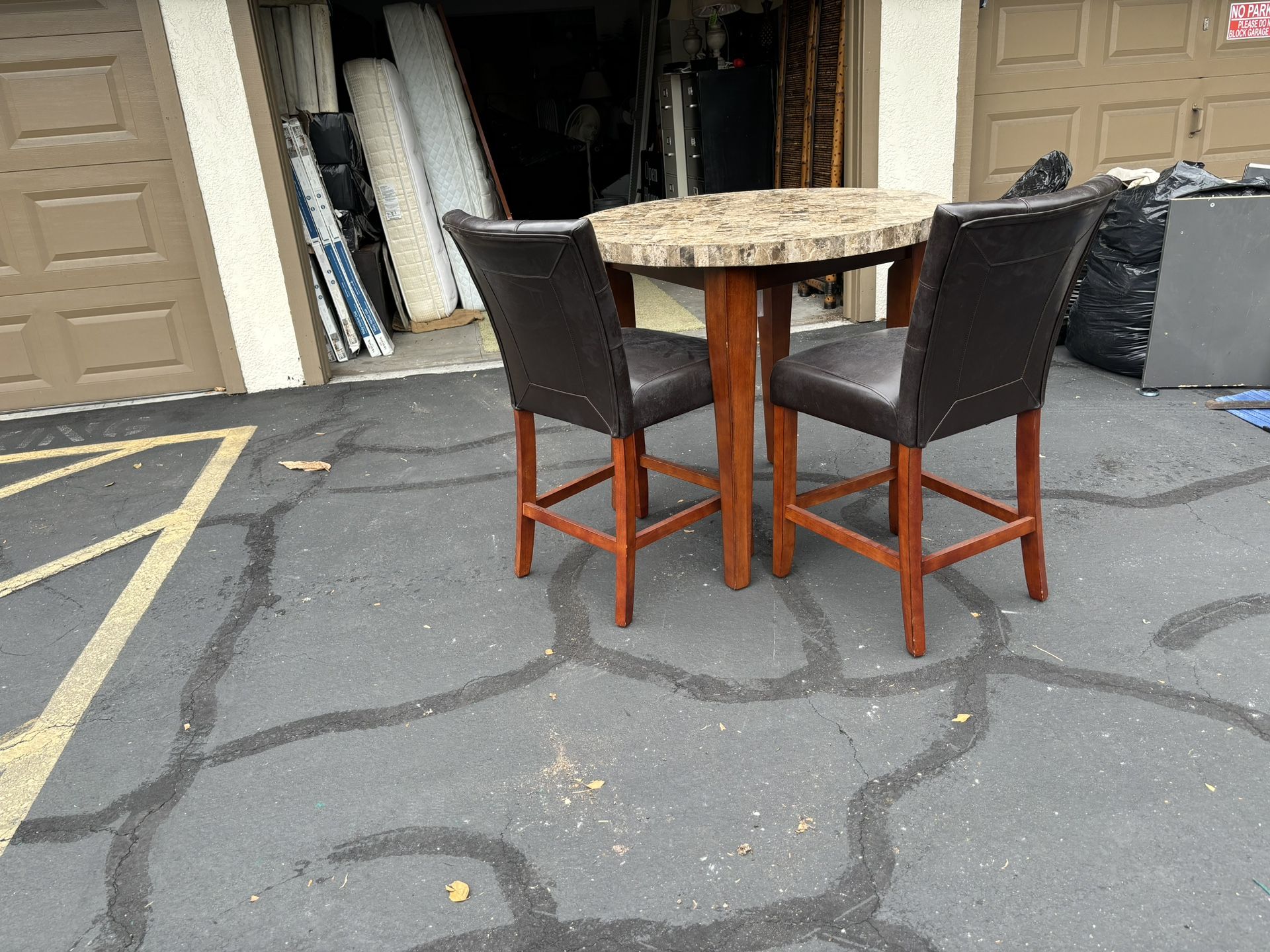 High Top Marble Table And 2 Leather Chairs 