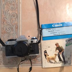 Canon AE-1 camera with accessories plus Vivitar accessories