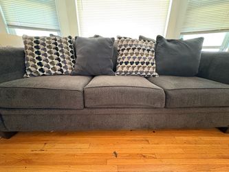 Sofa and loveseat, made by Ashley furniture, dark gray