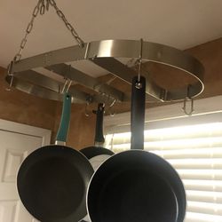 Chrome Hanging Pots And Pans attaches To The Ceiling 