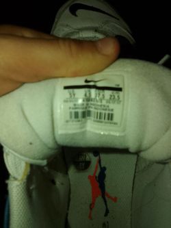 The show name is the Nike AiR 33 the color is White and blue and  a little bit of Orange the shoe size is 5y in boys size.