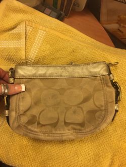 COACH GOLD CANVAS AND LEATHER CLUTCH