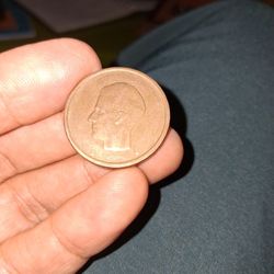 Belgian 20 Francs coin featuring King Baudouin I, minted between 1980 and 1993. 
Denomination: 20 Francs (20 BEF).
Composition: Nickel-Bronze