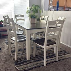 Like new two tone table and six chair chairs