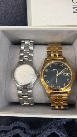 Pre-owned Coach Swiss quartz watches like yours go for roughly **$50–100**; the Marc by Marc Jacobs gold/black logo dial typically fetches **$35–75**.