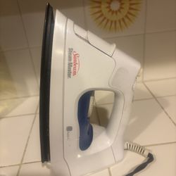 Sunbeam Steam Master iron, commonly used for removing wrinkles from clothes