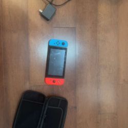 Nintendo Switch + Case+ Charger ( PRISTINE CONDITION)