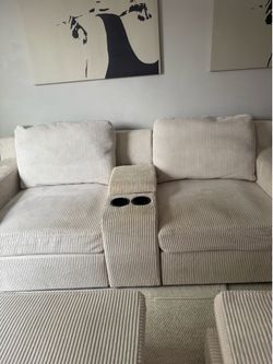 Cream sofa w/two ottomans
