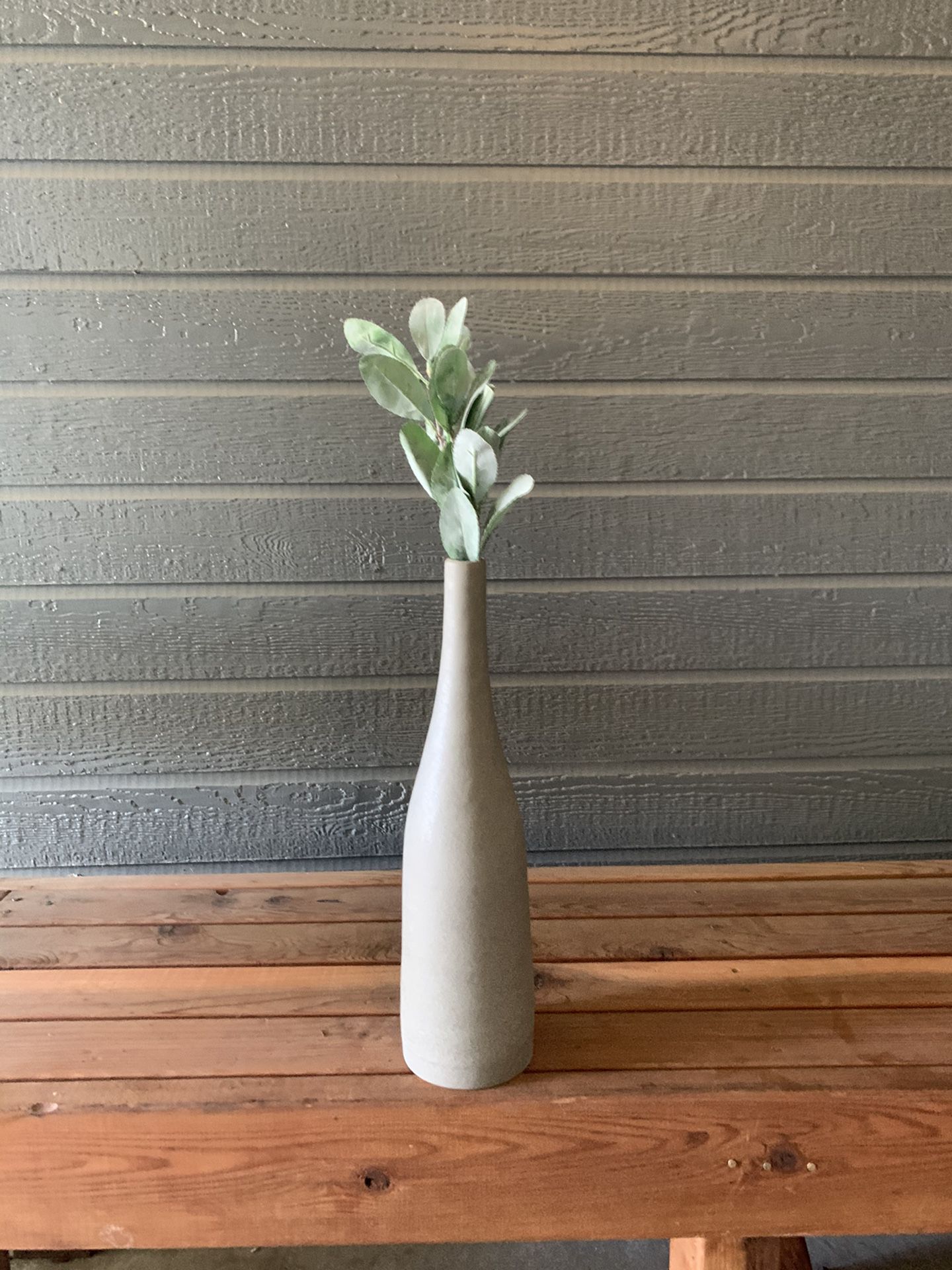 Large ceramic vase with fake plant