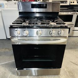LG stainless steel gas stove with a receipt for a 90-day warranty