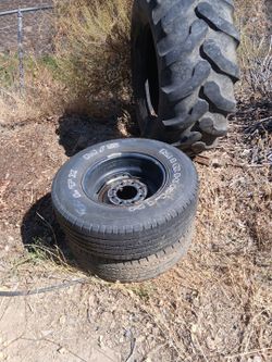 2 car tires, 1 tractor tire
