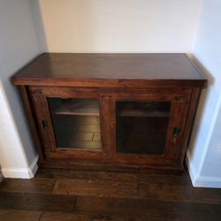 Wood Cabinet With Sliding Hlass Doors.