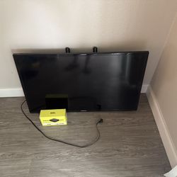 Samsung TV, Onn 4k Streamer & TV rack