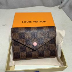 Louis Vuitton women’s brown wallet-purses