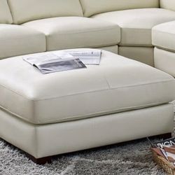 Plush Leather Ottoman Atanisha Lark Manor (Wayfair)