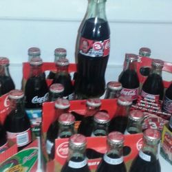 Dale Earnhardt and Dale Earnhardt Jr coca cola bottles 8oz never been opened I good condition