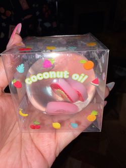 Coconut oil ball with strawberries slices charms inside