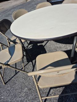 (1) 4ft round table with 8 folding chairs