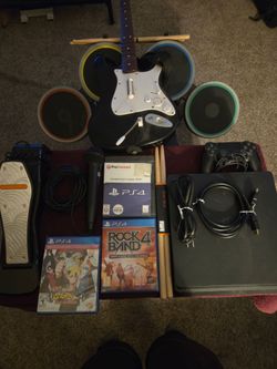 PS4 Slim 1Tb Rock Band 4 Bundle with Guitar, Drums and wired microphone