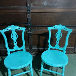 set of two antique matching teal chairs