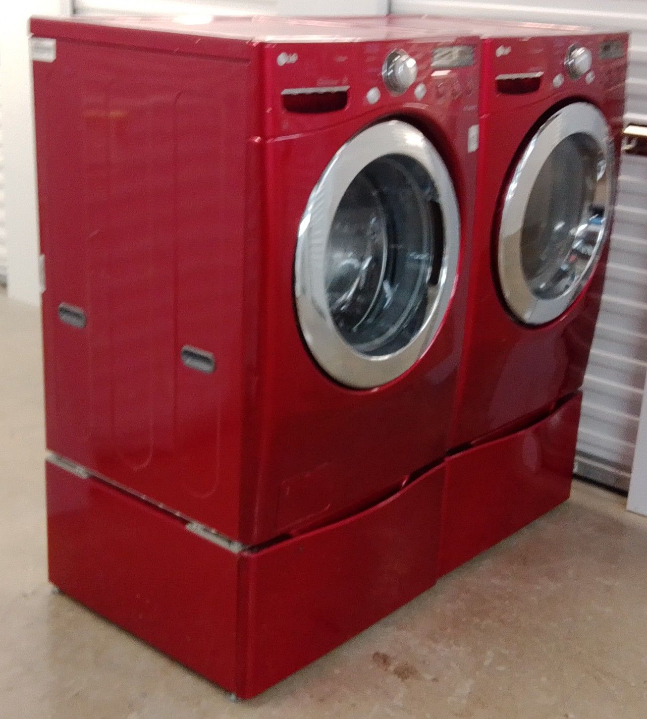 L,G CANDY RED HIGH EFFICIENCY FRONT LOAD WASHER AND DRYER ENERGY EFFICIENT ON SALE WITH PEDESTALS WARRANTY AND DELIVERY AVAILABLE