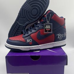 Nike Dunk SB High X Supreme ‘By Any Means’ Red Navy DN3741–600 Men’s Size 9  100% authentic. Brand new in box.   The Nike Dunk SB High X Supreme ‘By A