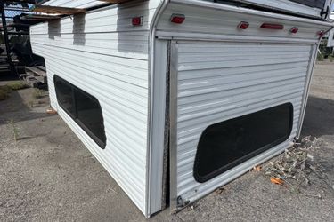 wood and aluminum camper shell fits a 2015-2026 F150 8 Ft bed selling for  4900$