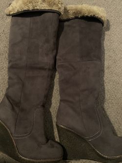 Faux fur lined wedge grey boot. Warm never worn. Size 7