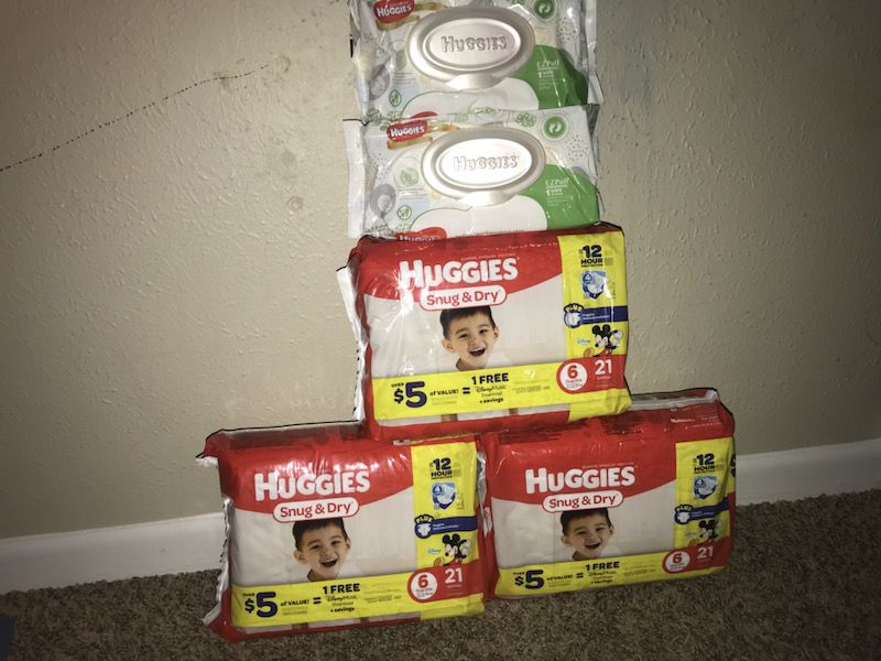 3 Huggies size 6 diapers and 2 packs of wipes