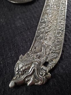 Metal hand of hamsa and metal dragon insence burner