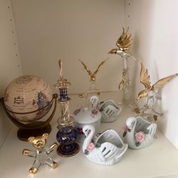 Swan ,dolphin  bird figures and a globe