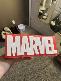 High quality 3D printed superhero style display sign, perfect for a desk, shelf, gaming setup, or movie room. Printed using durable PLA plastic