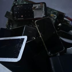 Box of electronics for parts - phones, tablets, boards