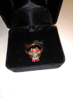 Ladies size 8 - 14 k gold with. 20 cts Ruby and. 20 cts diamond ring