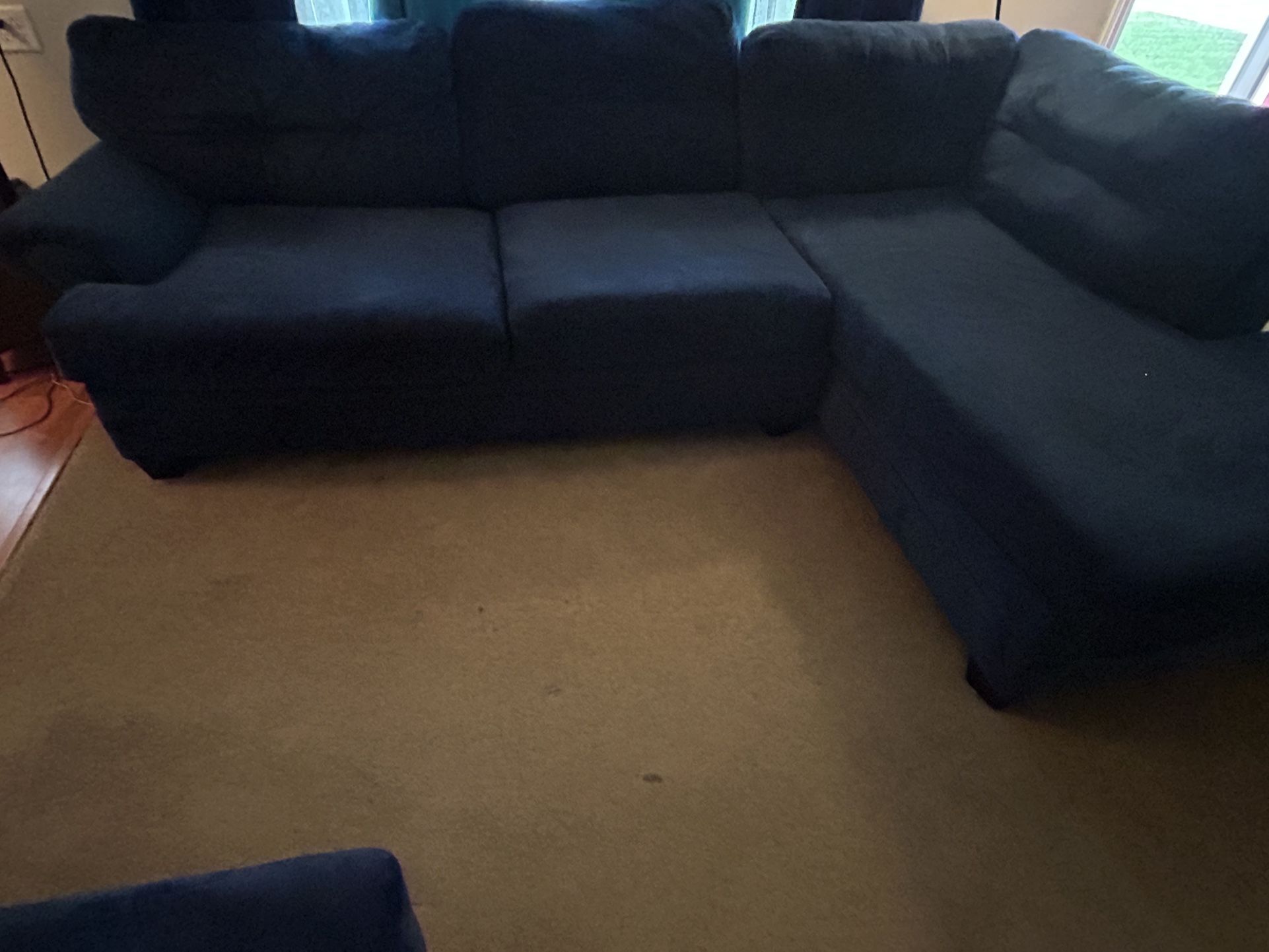Blue Couch With Ottoman .