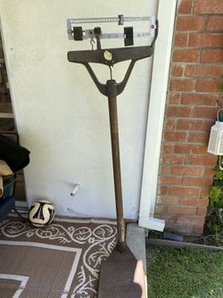 Antique iron standing scale