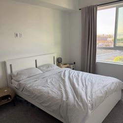 IKEA MALM queen-size bed frame with mattress included.