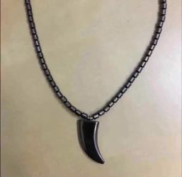 Hematite beads necklace with tooth pendant