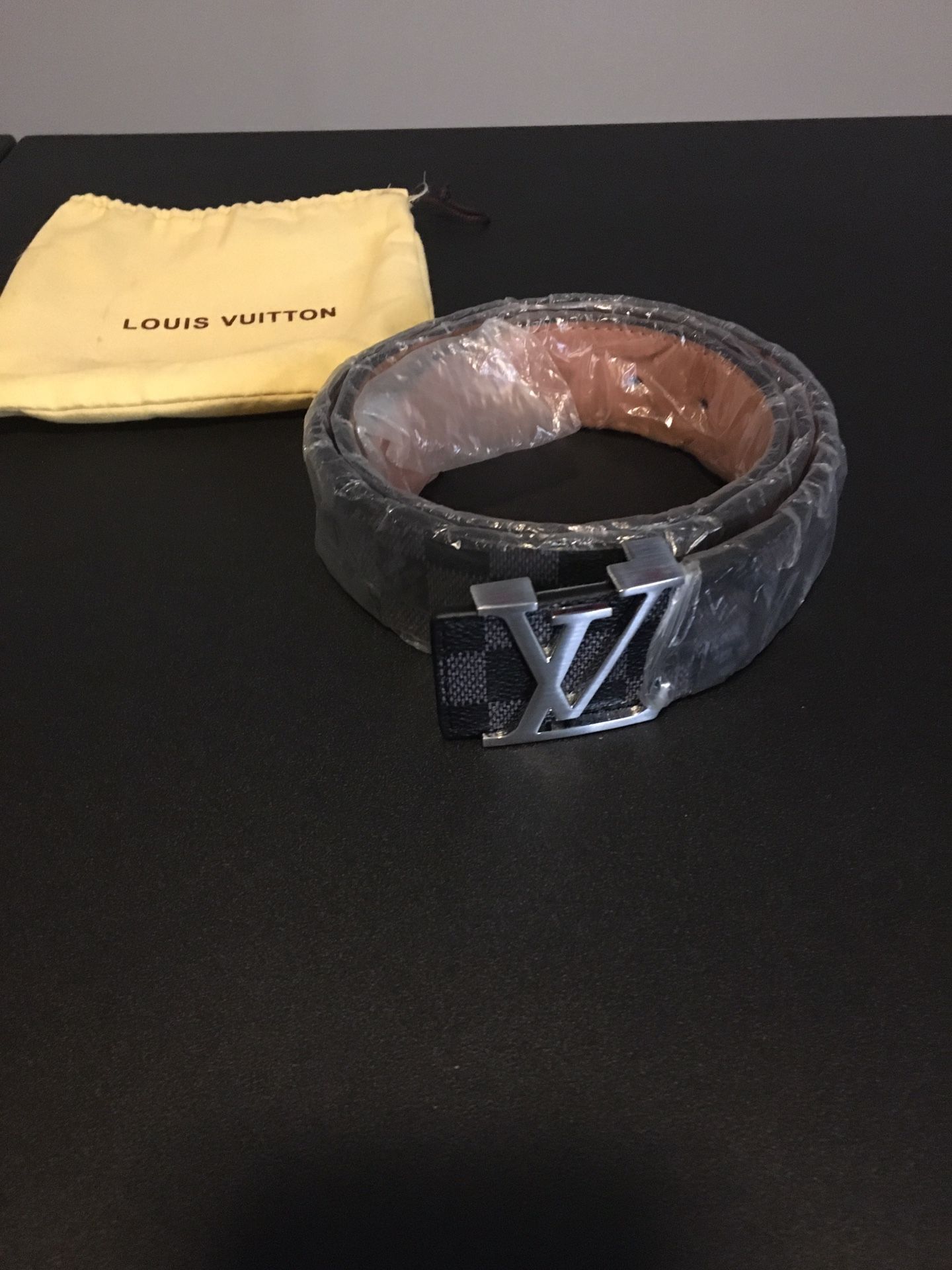 Gray and black Leather Louis Vuitton Belt. Size 44/110. This will fit a  waist size from 32 to 36 for Sale in Fort Stewart, GA - OfferUp