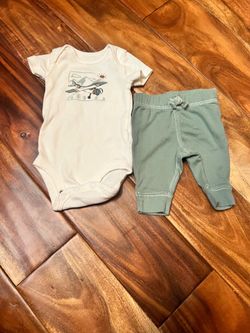 Baby boy carter’s newborn airplane outfit.