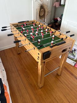 Foosball Table with Red and White Players