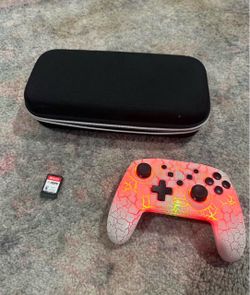 I'm selling a wireless LED controller, a physical copy of FIFA 2024, and a carrying case for the console—all for 50.