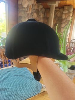 Black velvet English show riding helmet