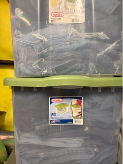 Two containers full of jeans