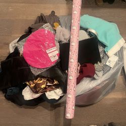 A Bag Of Clothes With Different Items In There