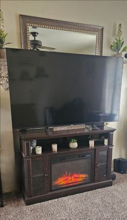 Tv stand with fireplace (not tv)