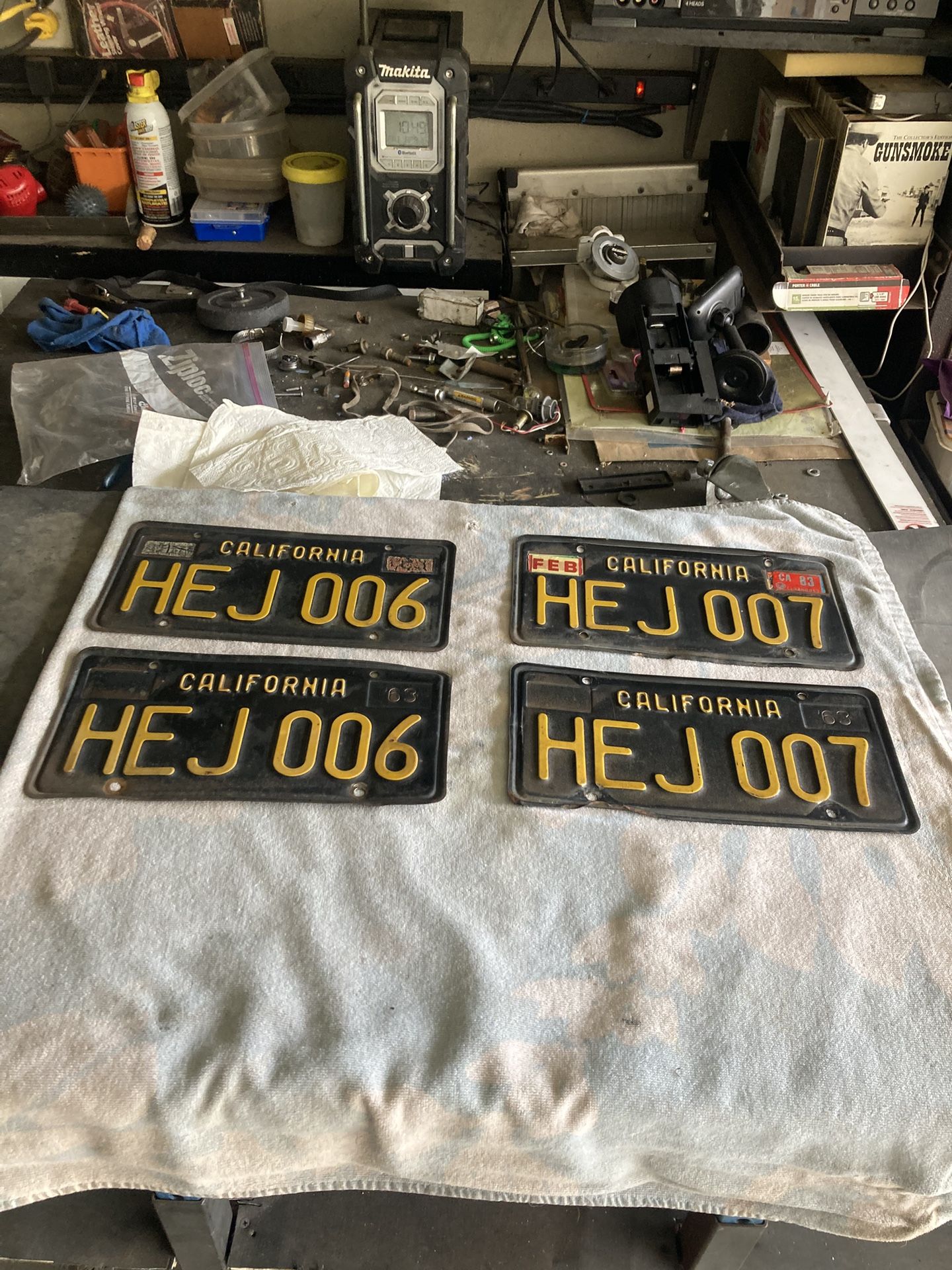 Two sets of old 1963 license plates.