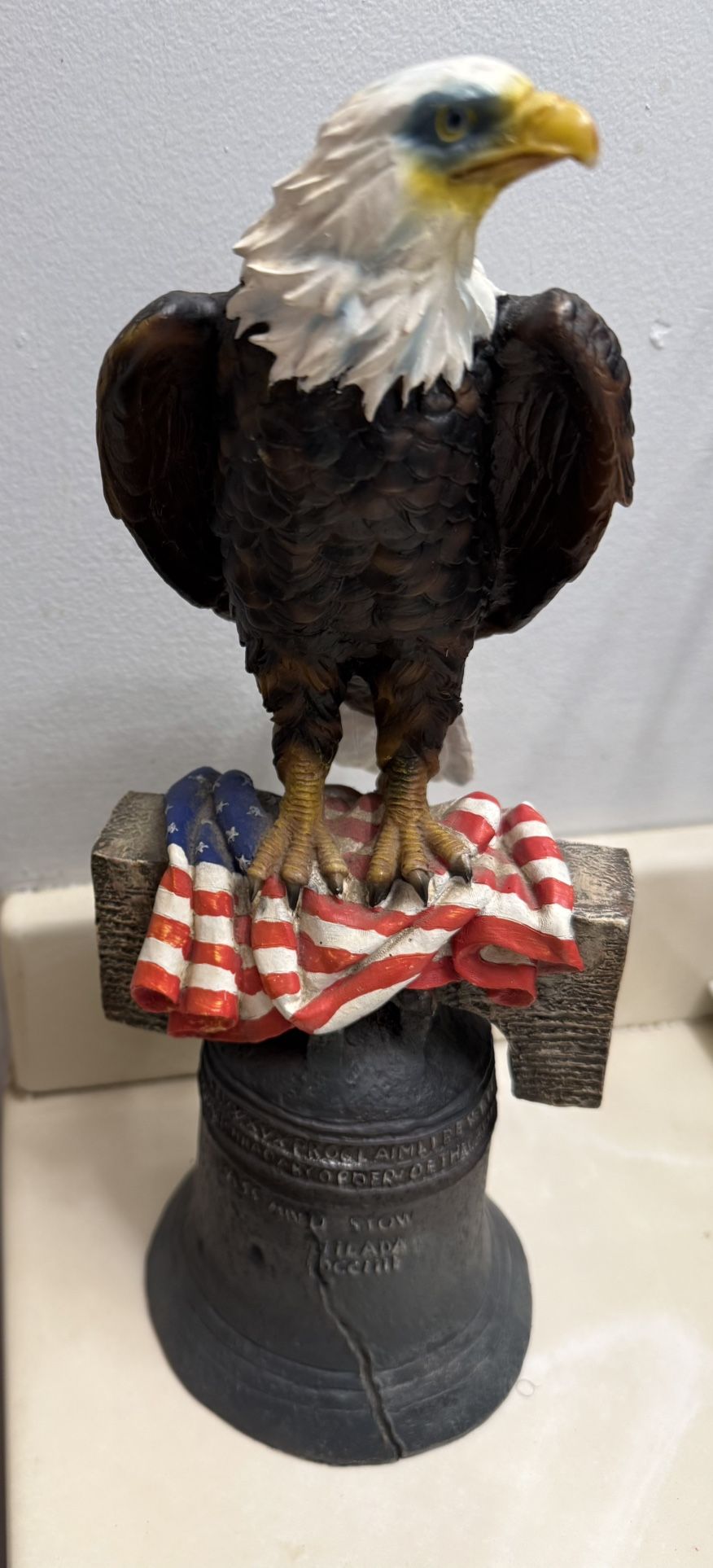 Bald Eagle Statue On Liberty Bell With USA Flag